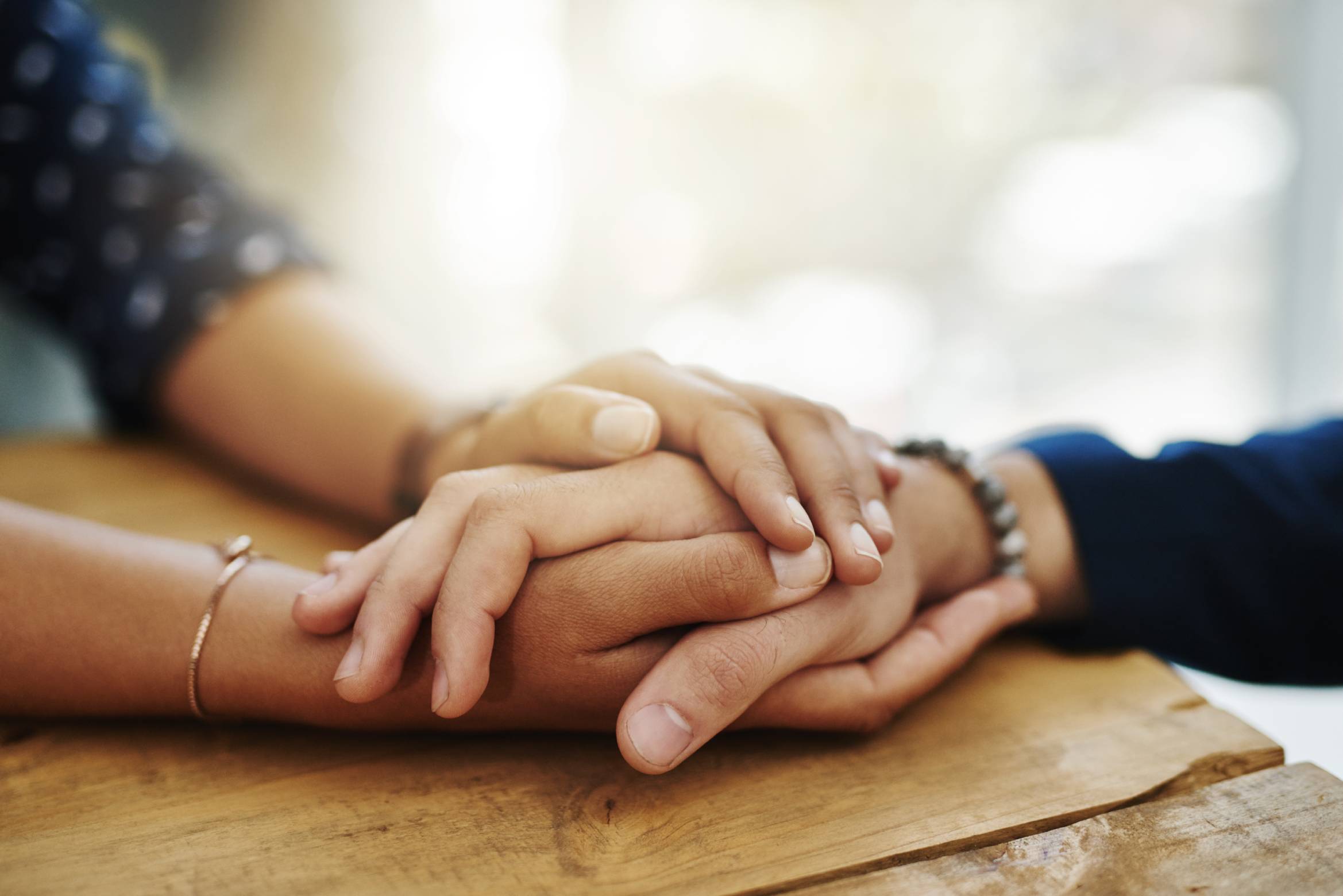 Close-up on hands together